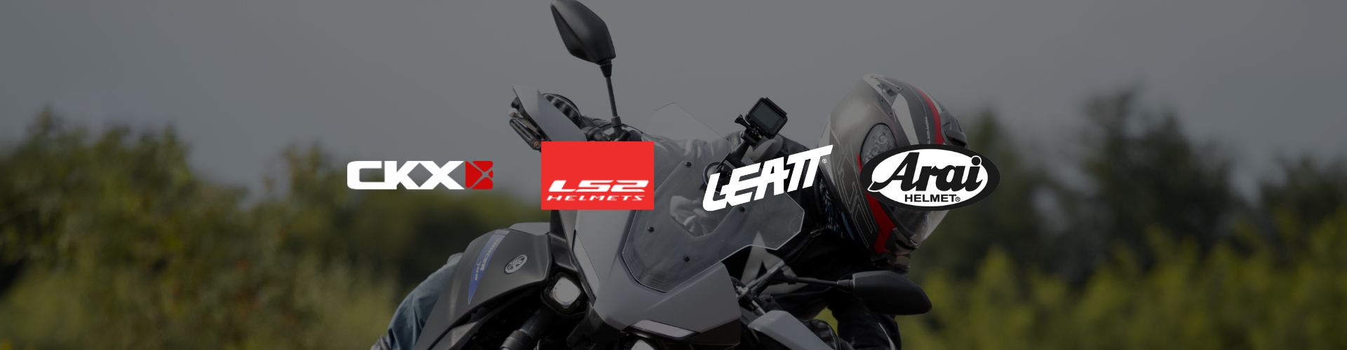 List of Helmet brands CKX, LS2, LEATT, ARAI with overlay background of motorcycle rider drifting turn